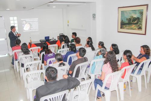 a group of people sitting in chairs in a room at Hotel Villa Rita Chiclayo in Chiclayo