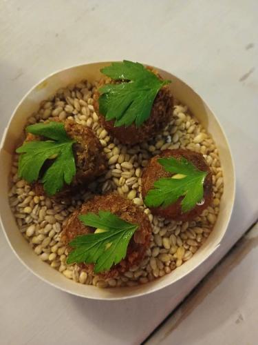 a bowl of food with meatballs on top of beans at Earsham Street House in Bungay