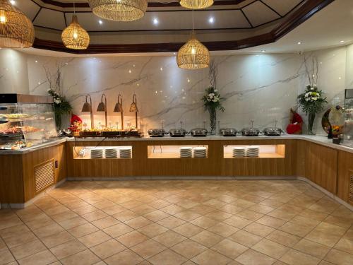 a kitchen with a counter with a stove top at Aanari Hotel & Spa- Mauritius in Flic-en-Flac