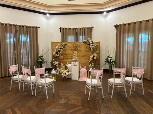 a set up for a wedding with chairs and a table at Aanari Hotel & Spa- Mauritius in Flic-en-Flac