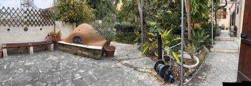 a garden with a bench and some plants at Vasilion Agrotourism in Polis Chrysochous