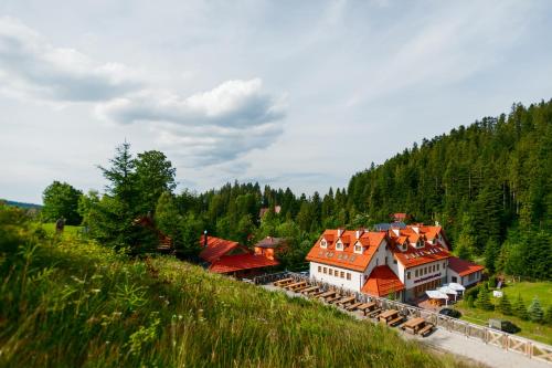 an aerial view of a building with red roofs at Hotel Fero Lux in Korbielów