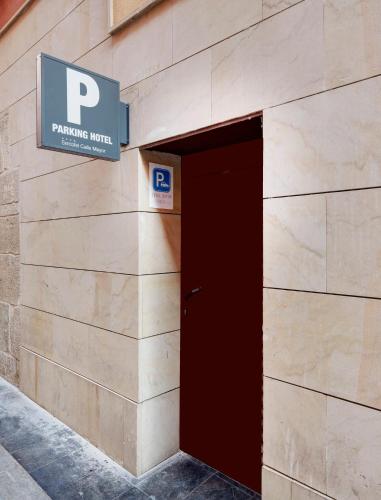 a sign on the side of a building with a door at Sercotel Calle Mayor in Logroño