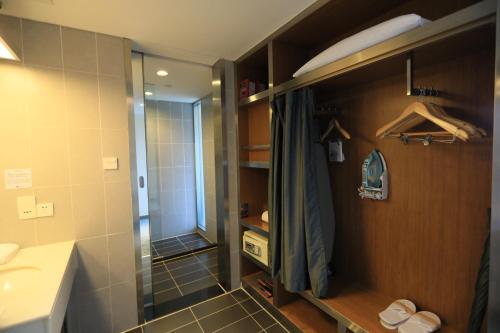 a bathroom with a shower and a sink at Aloft by Marriott Beijing, Haidian in Beijing