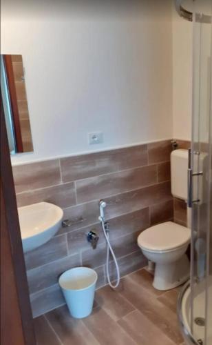a bathroom with a toilet and a sink at Hotel Anny in Cervia