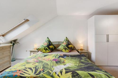 a bedroom with a bed and two pillows at Haus Bodanblick in Bodman-Ludwigshafen