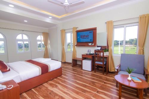 Postel nebo postele na pokoji v ubytování Hotel Yatra Sauraha Pvt Ltd