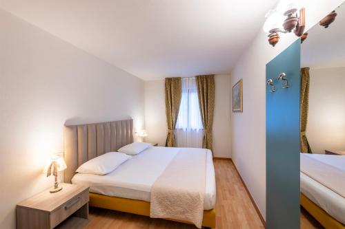Katil atau katil-katil dalam bilik di Hotel Pineta Campi