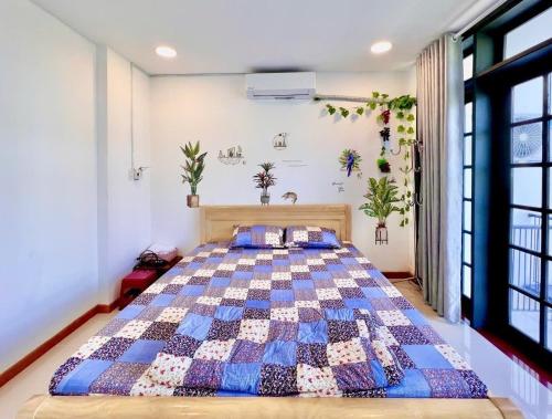 Ένα ή περισσότερα κρεβάτια σε δωμάτιο στο KENZPIA Homestay