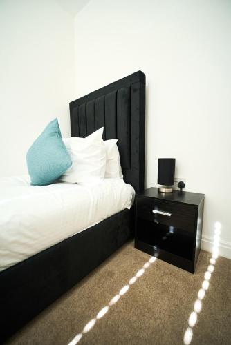 Katil atau katil-katil dalam bilik di Modern 4-Bed Home, Tranent