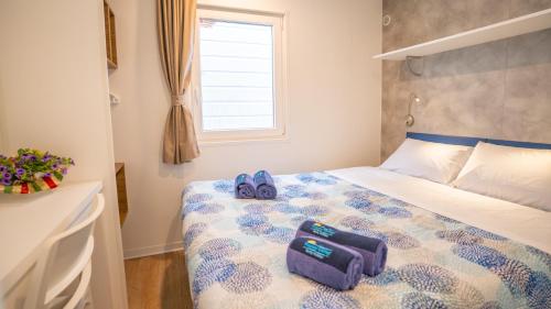 Postel nebo postele na pokoji v ubytování Happy Camp in Don Antonio Glamping Village