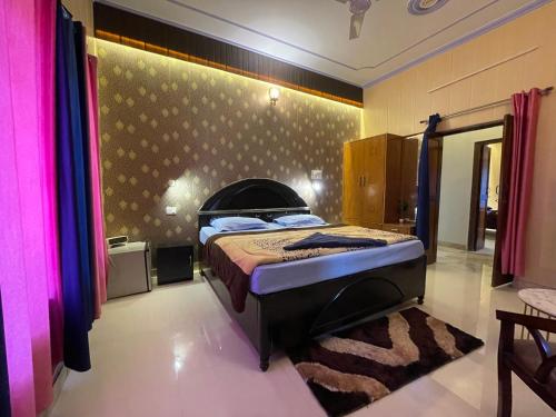 a bedroom with a bed in a room at Sapphire Stay in Bhowāli