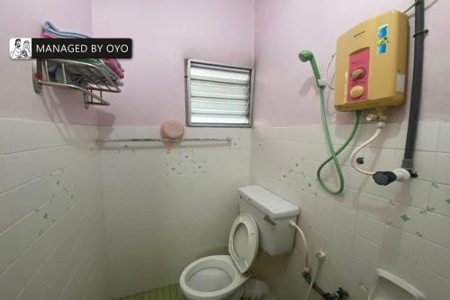 Ένα μπάνιο στο Hotel O Lumut Villa Inn