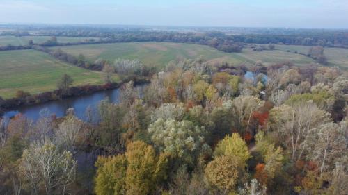 an aerial view of a river and trees at Kamilla Apartmanház Somogyudvarhely OLYANMINTOTTHONCSAKMÉGJOBB in Somogyudvarhely