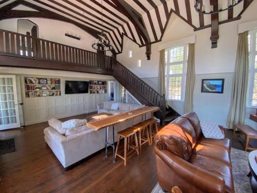 a living room with a couch and a table at Holden Frost House in Franconia