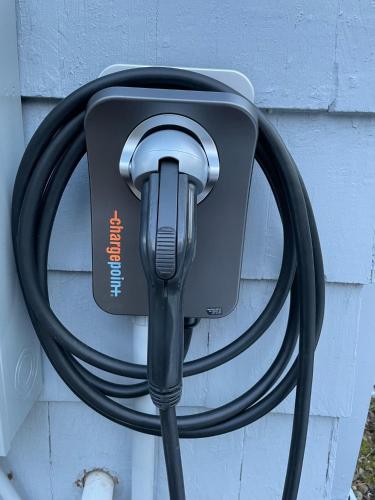 a hose is hooked up to a car charger at Holden Frost House in Franconia