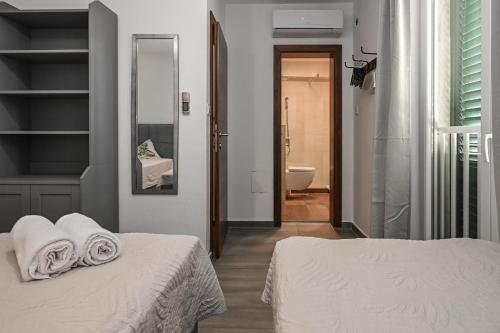 Postel nebo postele na pokoji v ubytování il Centro Apartments Novalja