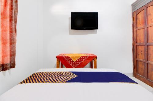 Postel nebo postele na pokoji v ubytování Hotel O Daffsell Homestay Syariah