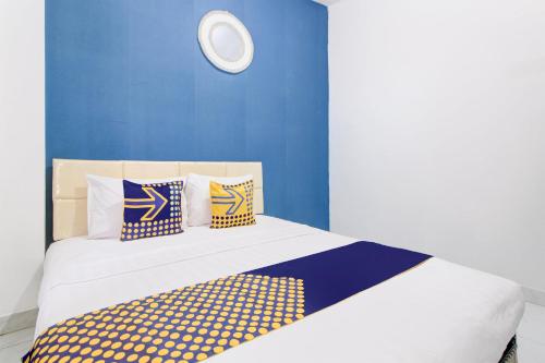 Postel nebo postele na pokoji v ubytování Hotel O Daffsell Homestay Syariah