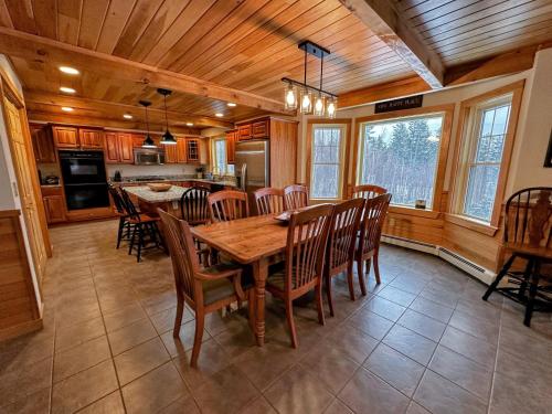 a kitchen and dining room with a wooden table and chairs at HL96 Single family home with views and lots of space Privacy convenience AC and style in Carroll