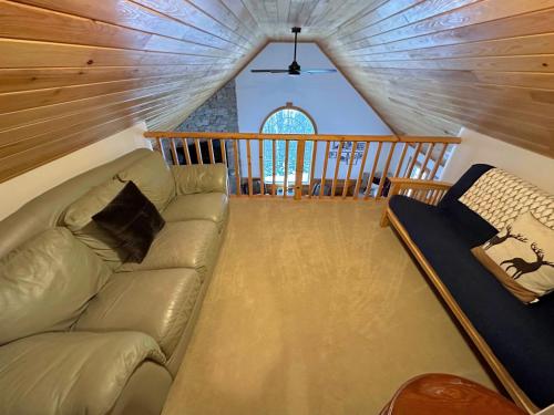 a living room with a couch in the attic at HL96 Single family home with views and lots of space Privacy convenience AC and style in Carroll