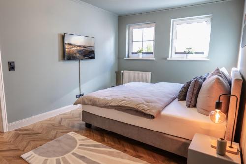 Katil atau katil-katil dalam bilik di NEU! Ferienwohnung Düne & Wind