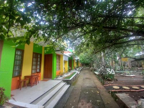 a row of colorful houses on a street at Casa Felicisima Inn in Puerto Princesa City