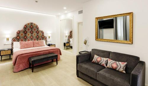 Кровать или кровати в номере Sercotel Las Casas de los Mercaderes