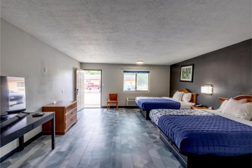 Freer Executive inn and Studiosにあるベッド