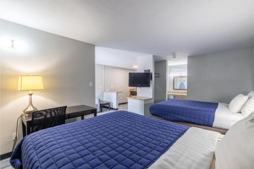 Freer Executive inn and Studiosにあるベッド