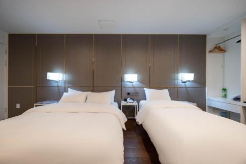 Ένα ή περισσότερα κρεβάτια σε δωμάτιο στο Amare Hotel Jongno