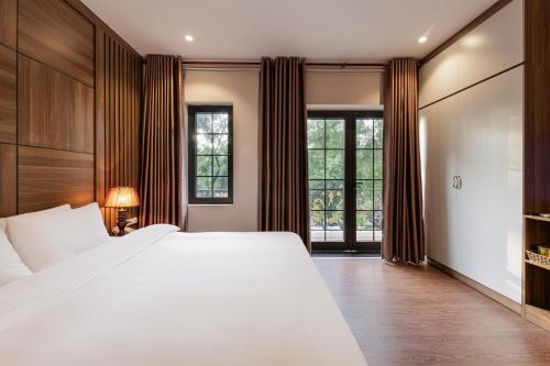 Katil atau katil-katil dalam bilik di Collection O Le Grand Hanoi hotel - The Central Park