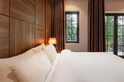 Katil atau katil-katil dalam bilik di Collection O Le Grand Hanoi hotel - The Central Park