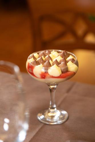 a dessert with chocolate and marshmallows in a wine glass at Hotel Stendhal in Parma