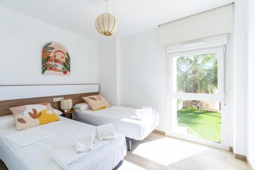 Ένα ή περισσότερα κρεβάτια σε δωμάτιο στο 3102 CAPRI Apartamento