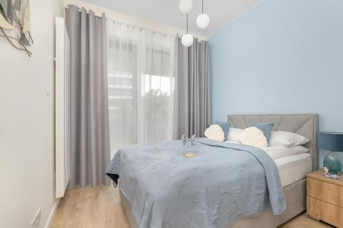 Ένα ή περισσότερα κρεβάτια σε δωμάτιο στο Apartment Relax with Parking Shellter Rogowo Renters Prestige