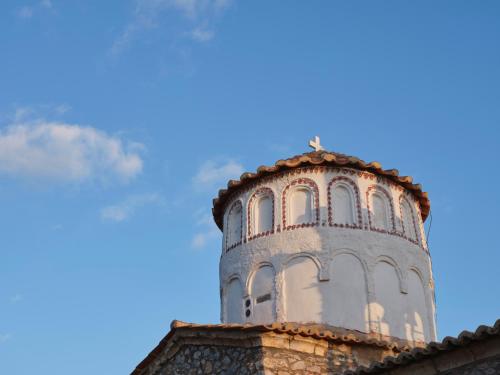 a tall tower on top of a building at Rubeas Towers - Pyrgos Towers Complex in Pírgos