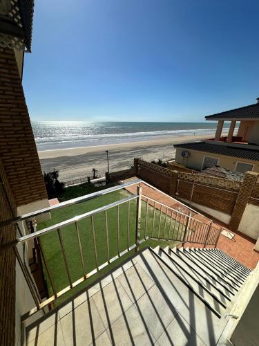 a balcony with a view of the beach at A la Orilla del Mar in Matalascañas