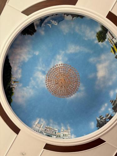 a domed ceiling with a depiction of the sky at Palette 823 Hotel Ichchha in Simara