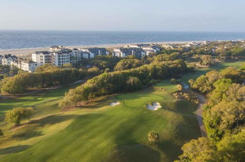 an aerial view of a golf course near the ocean at Grand Pavilion 29 by Wild Dunes in Isle of Palms