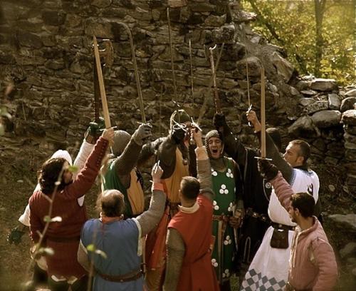 a group of people holding up archery arrows at Hotel Ristorante Franca in Tovo di Sant'Agata
