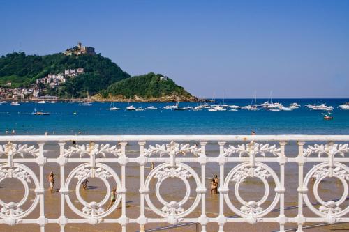 a balcony with a view of the water and boats at Sercotel Codina in Donostia-San Sebastián