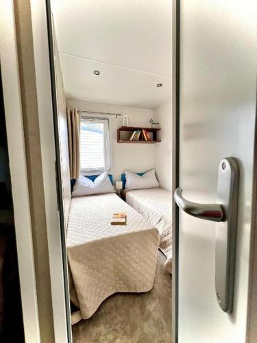 Letto o letti in una camera di Camping Village Tuscia Tirrenica