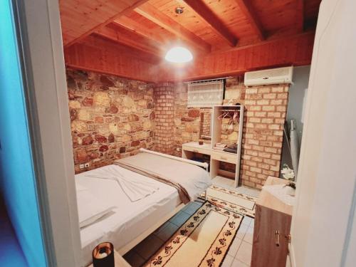 En eller flere senge i et værelse på Μεζονέτα