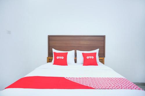Letto o letti in una camera di Hotel O Teluk Betung Near Water Park Lembah Hijau Formerly Kanajiwa Guesthouse 2