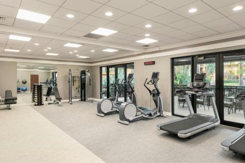 a gym with treadmills and elliptical machines at Courtyard by Marriott Boynton Beach in Boynton Beach