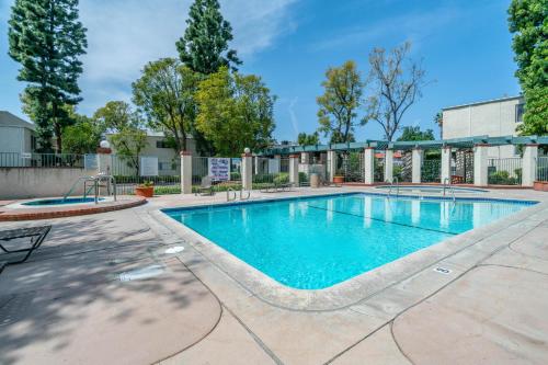 a swimming pool at a resort with trees at High Ceilings 3BR with Loft-2 Baths Pool & Jacuzzi in Tarzana