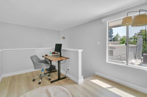 an office with a desk and a window at High Ceilings 3BR with Loft-2 Baths Pool & Jacuzzi in Tarzana