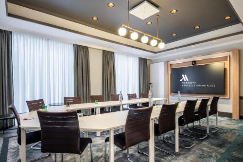 a conference room with a large table and chairs at Brussels Marriott Hotel Grand Place in Brussels