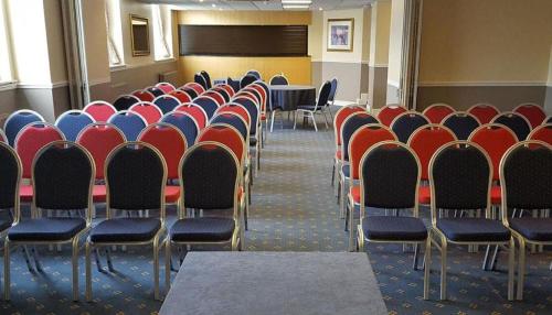 a room with rows of chairs in a classroom at Dancenter East Midlands Airport in Derby